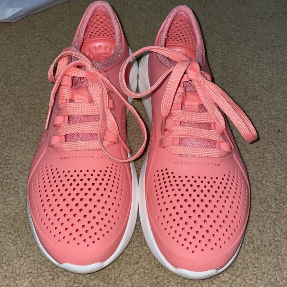 Pink crocs tennis shoes size W 9
